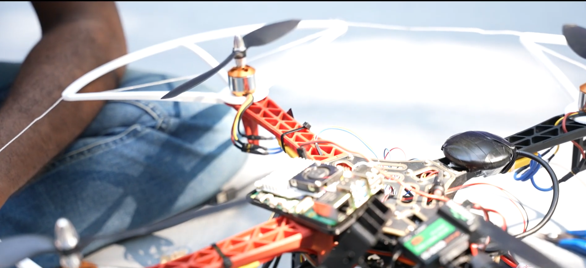 Close-up of the drone on the floor with my leg in frame