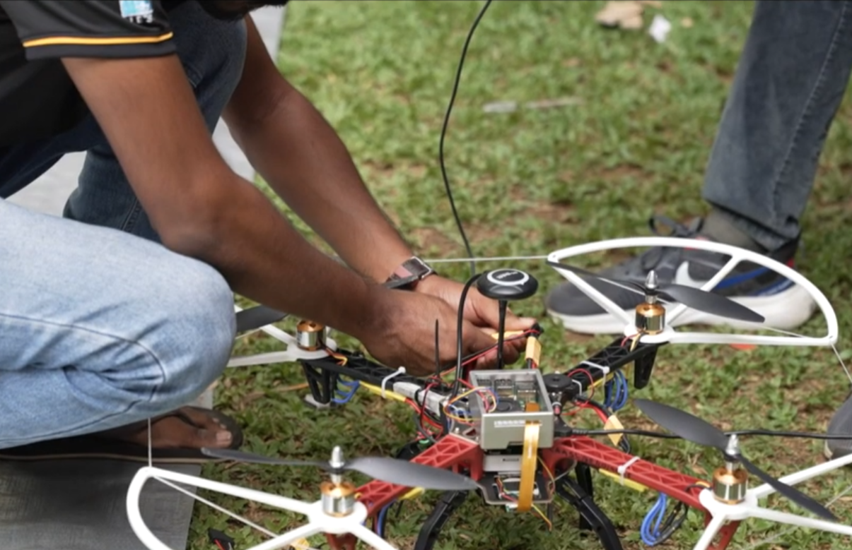 Us fixing the drone during troubleshooting